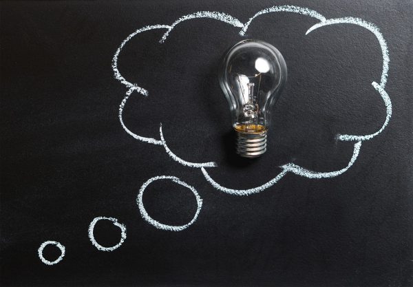 lightbulb in a thought cloud on a blackboard