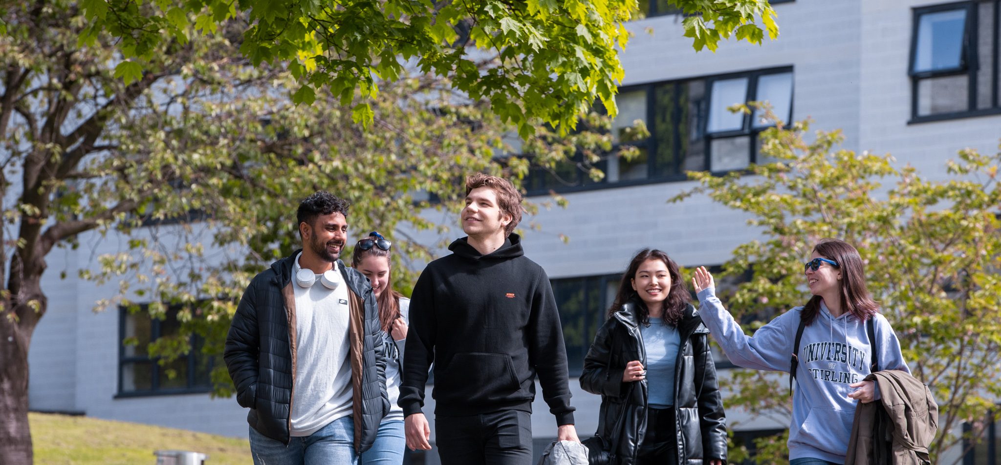 photo of students walking on campus - life skills at uni