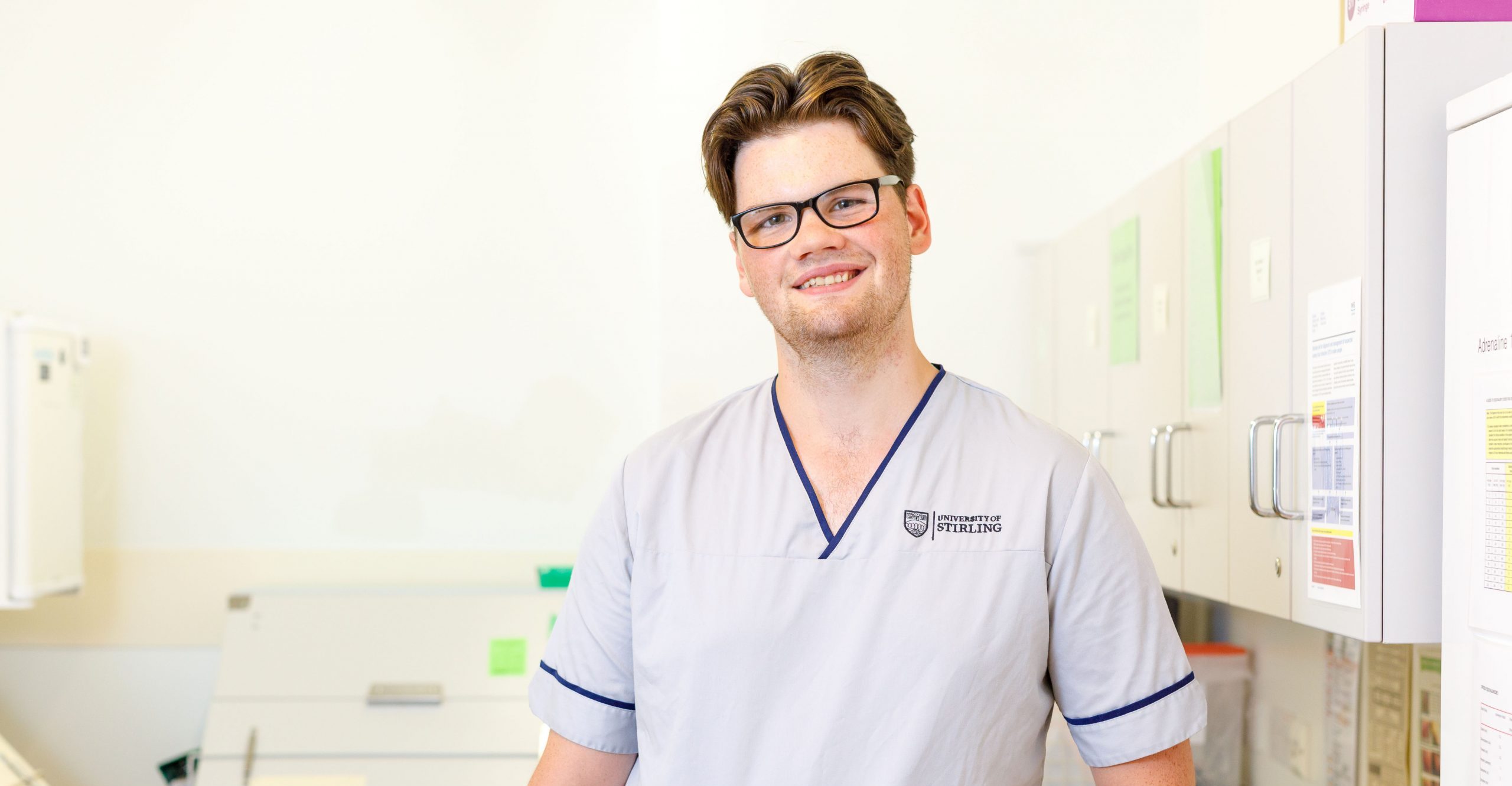 Scottish male undergraduate nurse in uniform at healthcare centre